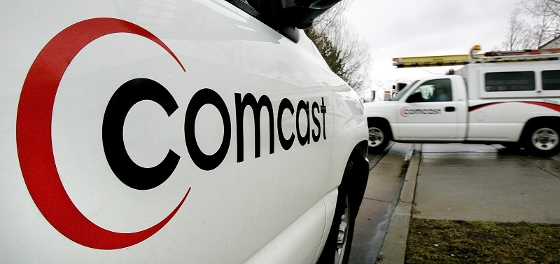 Comcast is forgiving old debts in a bid to sweeten up to regulators