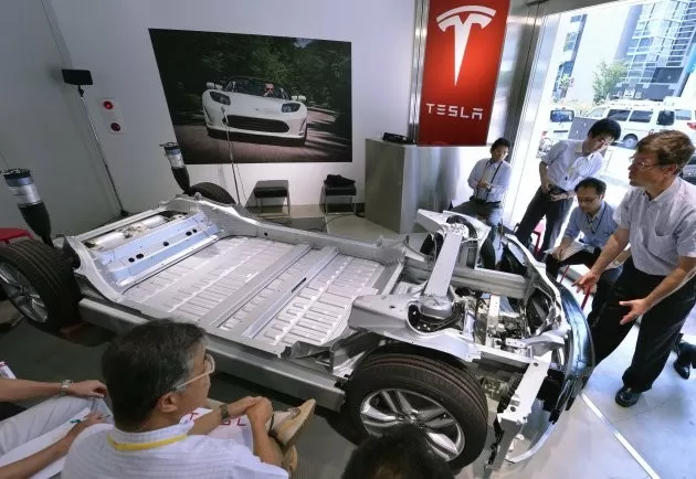 elon musk tesla f1 formula one tesla battery swap kenny handkammer michael schumacher sebastian vettel