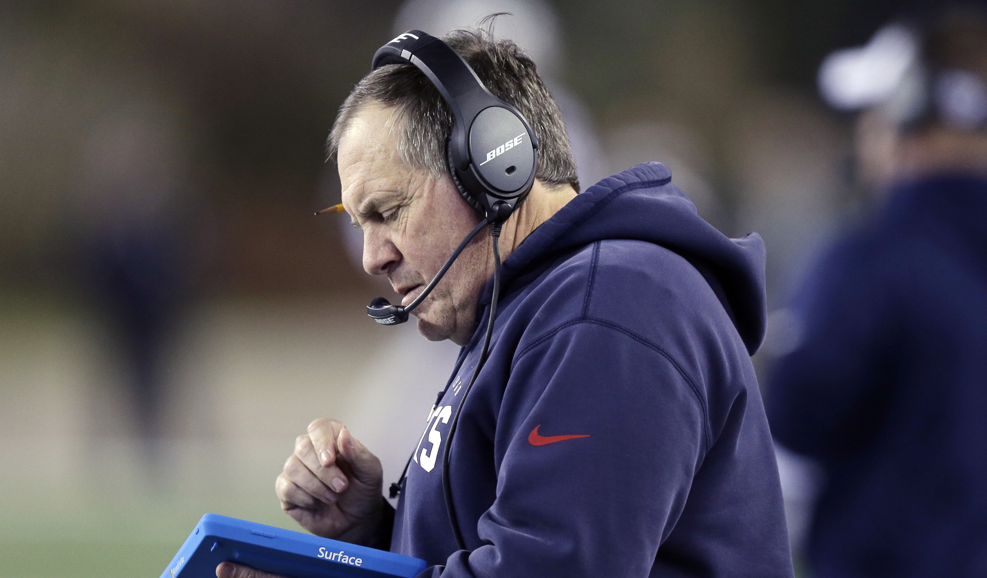 Coach Bill Belichick says Surface tablets on the sidelines are too undependable