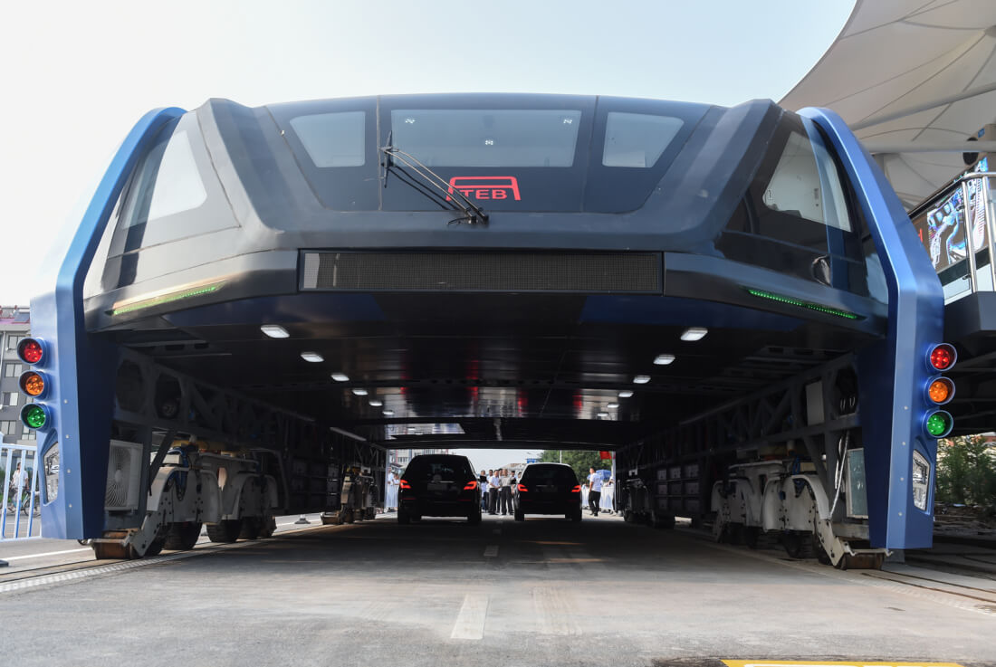 China's straddling bus now lies abandoned in the middle of the road