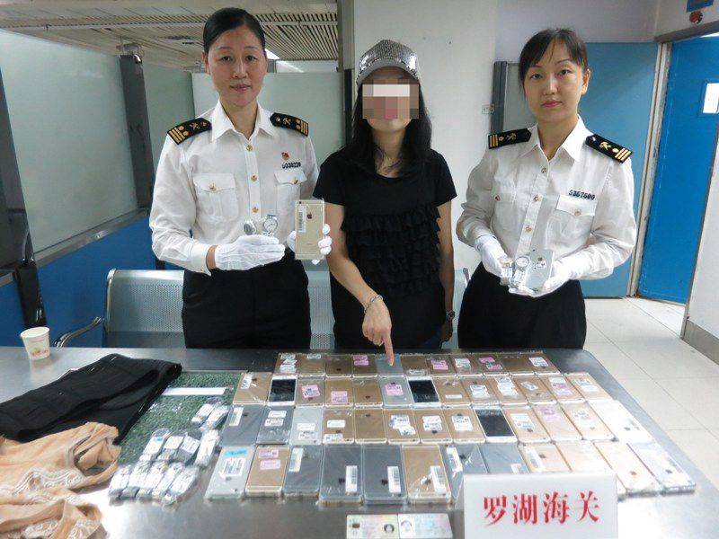 China customs officials bust woman smuggling 102 iPhones strapped to her body