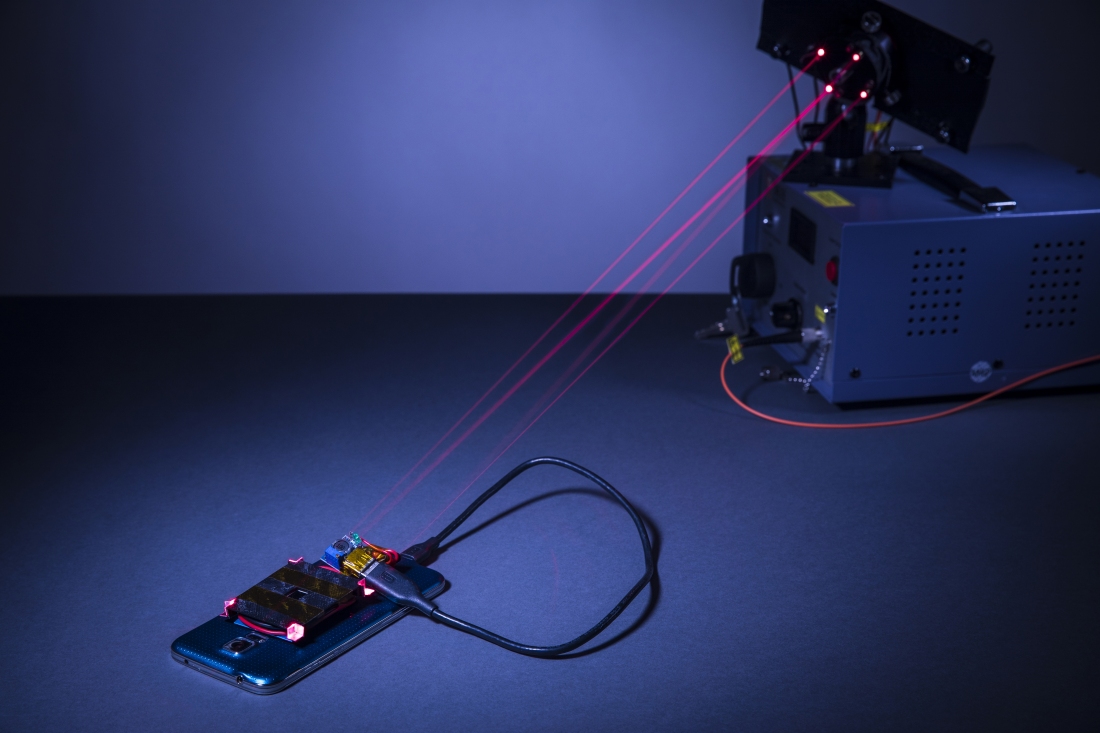 Prototype laser system can charge a smartphone from across the room