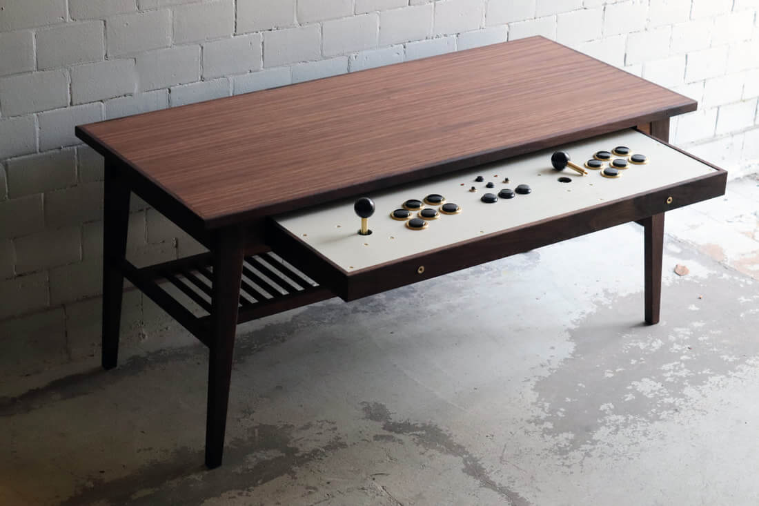 This unassuming coffee table transforms into an arcade machine