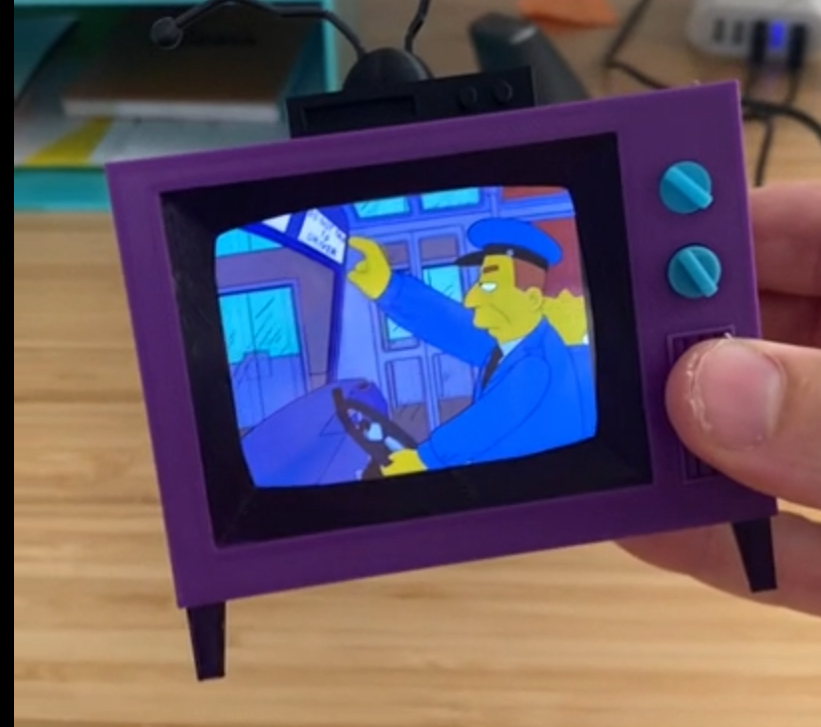 Check out this tiny Simpsons TV that plays random episodes of the show