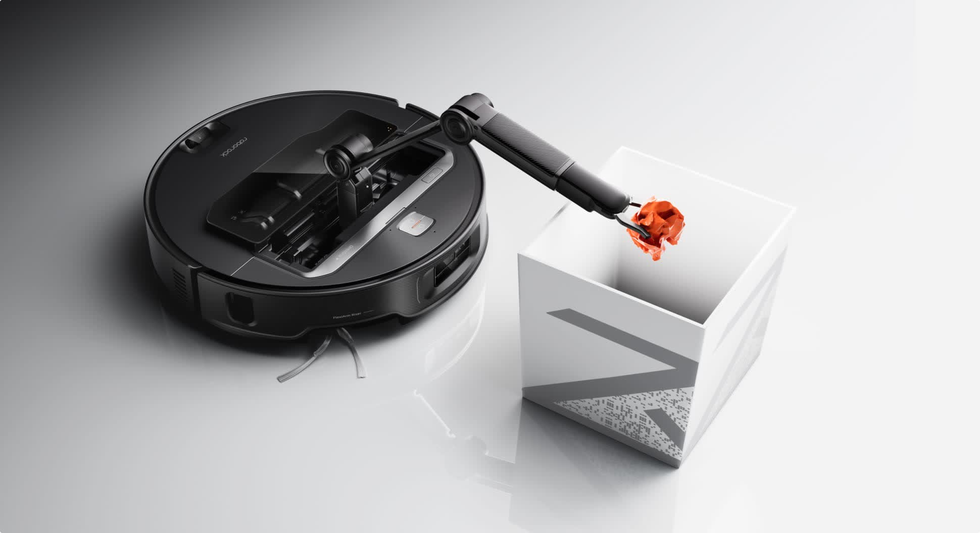An arm sticks out of this Roborock vacuum to move toys and socks out the way