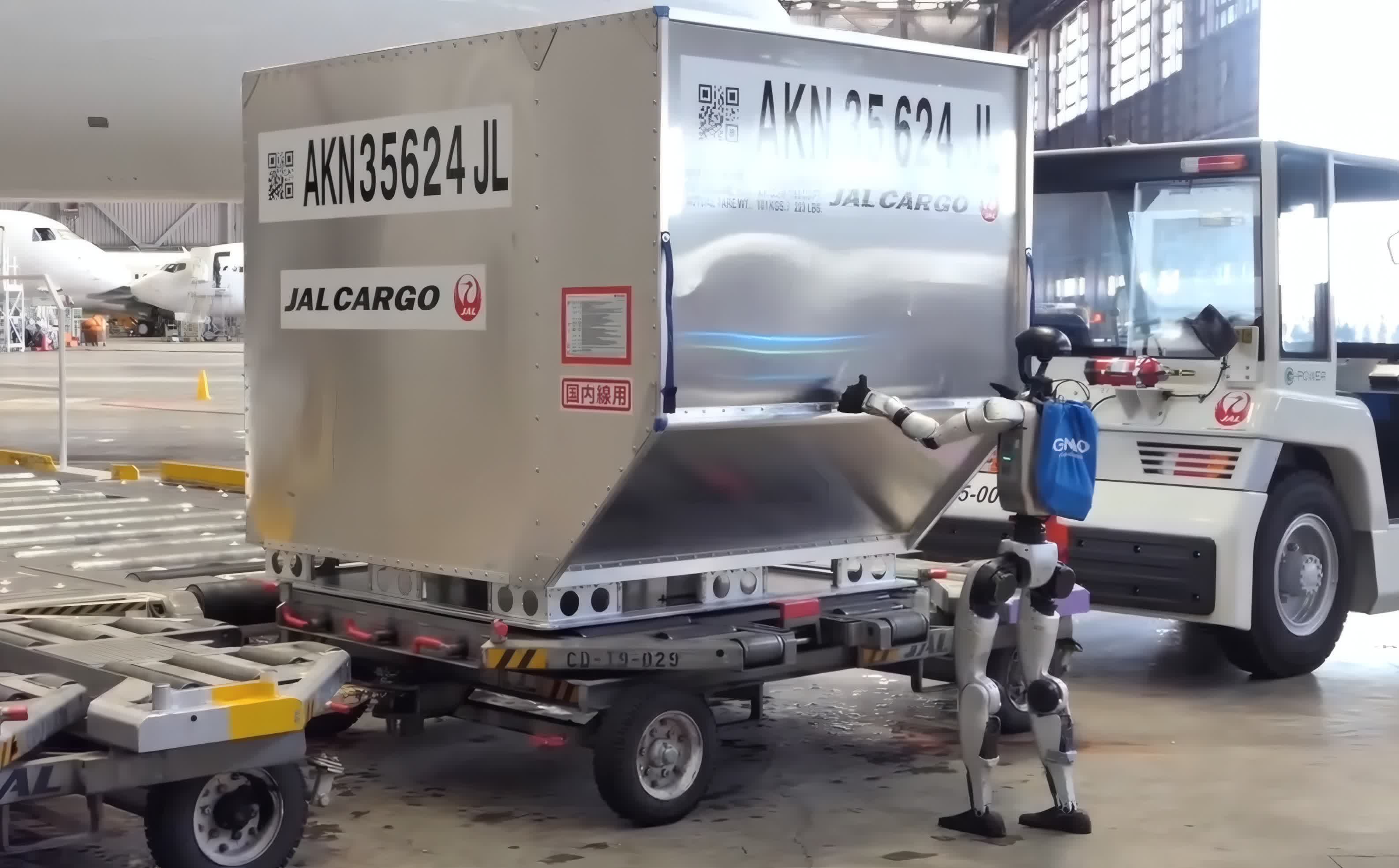 Humanoid robot assisting with airport cargo operations