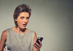 woman shocked mobile phone scared