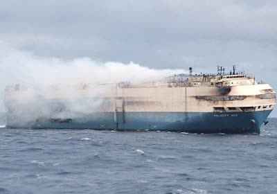 burnt- ship carrying porsches lamborghinis sinks rough seas volkswagen cargo ship