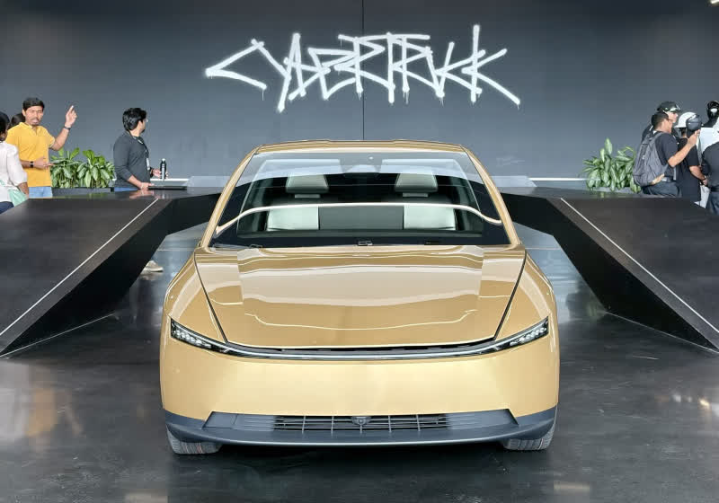 Tesla moves Cybercab from concept to factory floor, but lowers expectations for robotaxis